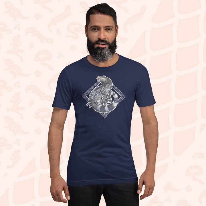 Man wearing a navy colored unisex crew neck tee with a graphic of a black and white tegu curled up in a graphic element.