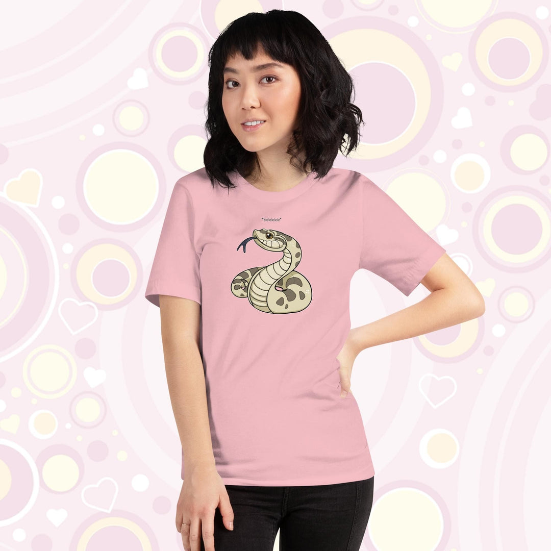 Lady wearing pink colored crew neck tee with a simple cartoony silly hognose flicking out it's tongue and saying "blelele".