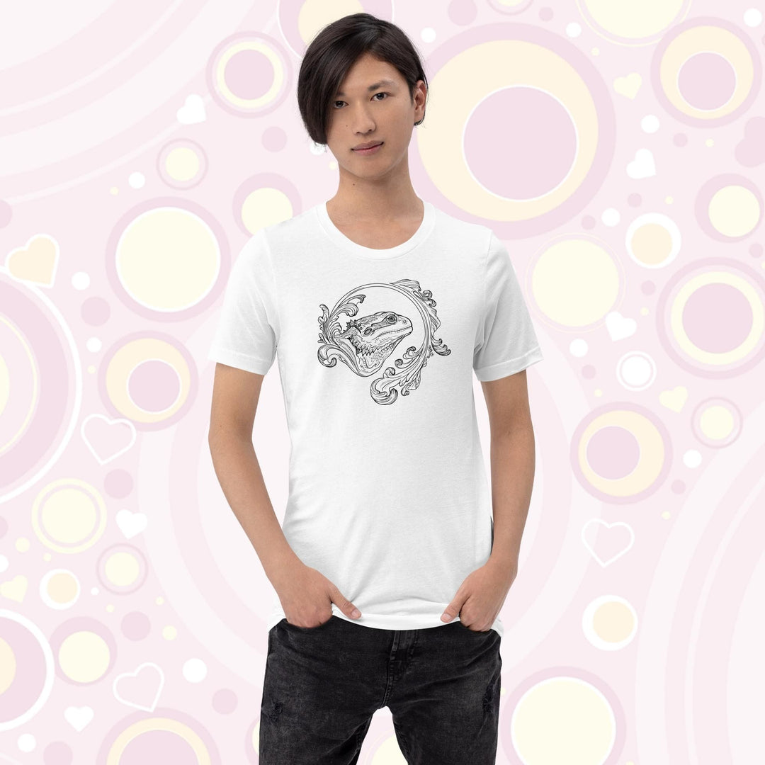 Person wearing a white crew neck tee showing an elegant design of a bearded dragon with a swooshing flourish design.