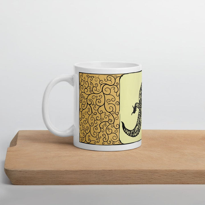A mug resting on a wood surface with it&