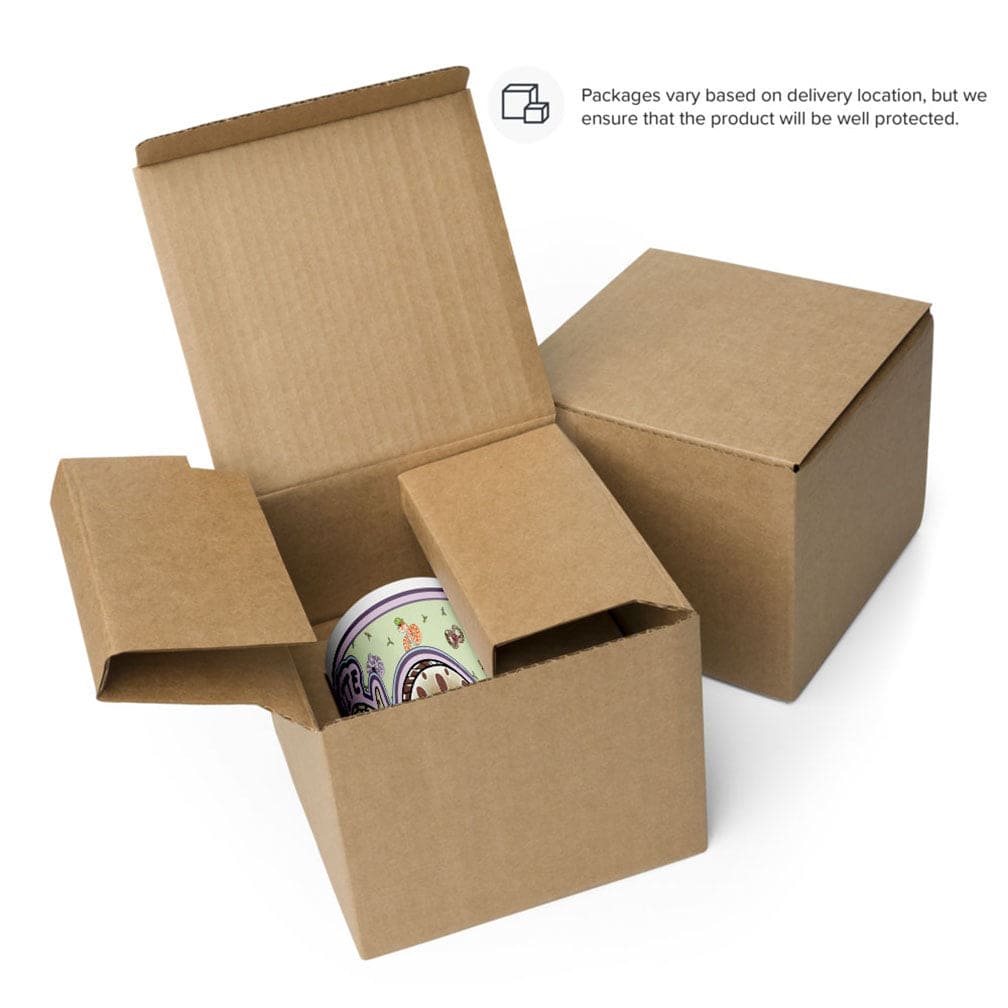 Open cardboard box with a mug inside and a closed box next to it. Both are resting on a white background.
