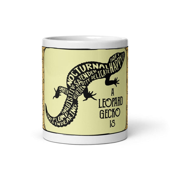 A white 11oz ceramic mug featuring a central pale yellow rectangular panel with a black silhouette of a leopard gecko. The gecko&