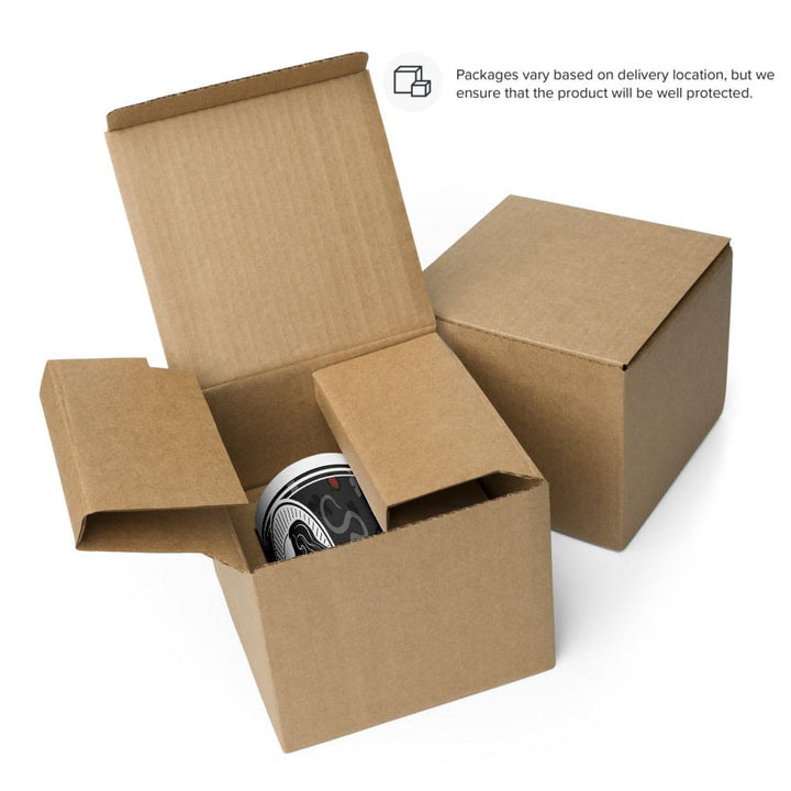 Two boxes, one open and other closed, showing how the mug will be packaged for shipping. You can see the mug inside.