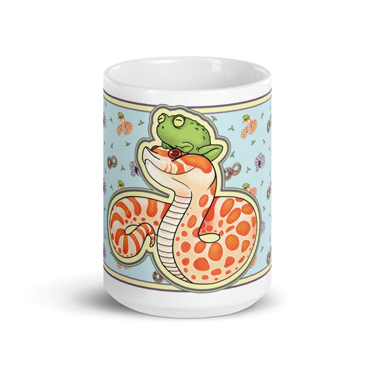 Image of a 15oz mug with a graphic showing the left side of the hognose with frog design. The background color is blue with lots of other hognose snakes and flowers surrounding it.