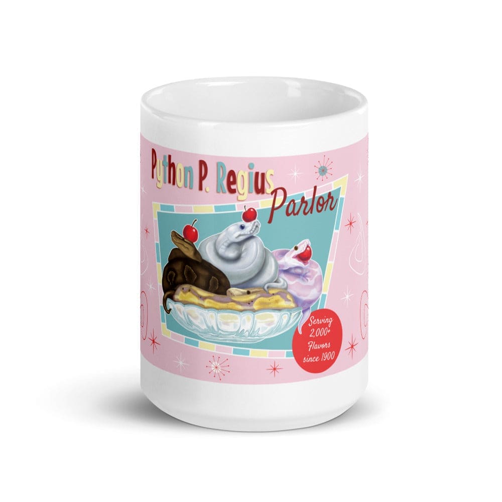 A white 15oz ceramic mug featuring a pink background with a graphic of three snakes in a glass bowl topped with cherries. The text reads Python P. Regius Parlor and Serving 2,000+ Flavors since 1900, accented with small starburst shapes.