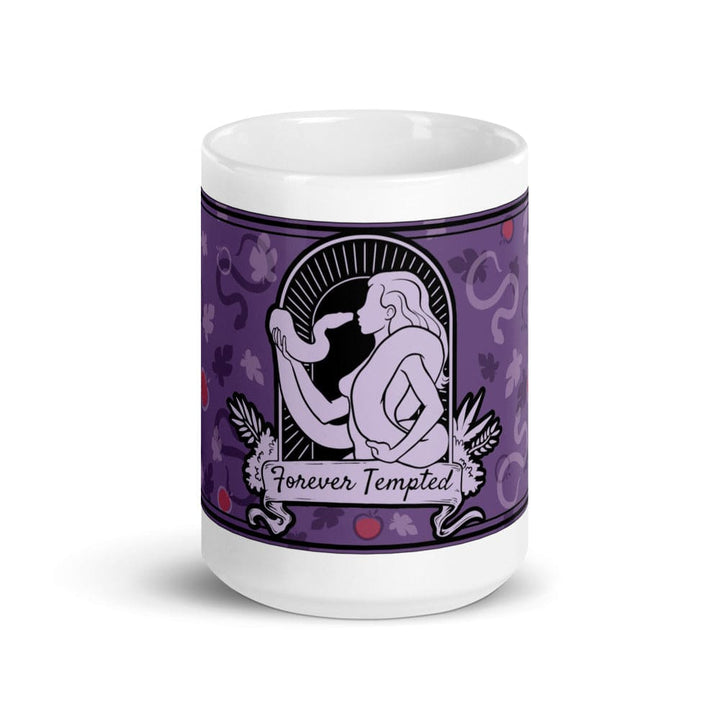 A 15oz white ceramic mug featuring a purple graphic illustration of a figure holding a snake within an arched frame. The text Forever Tempted is printed on a banner below the figure, surrounded by a pattern of leaves and red apples.