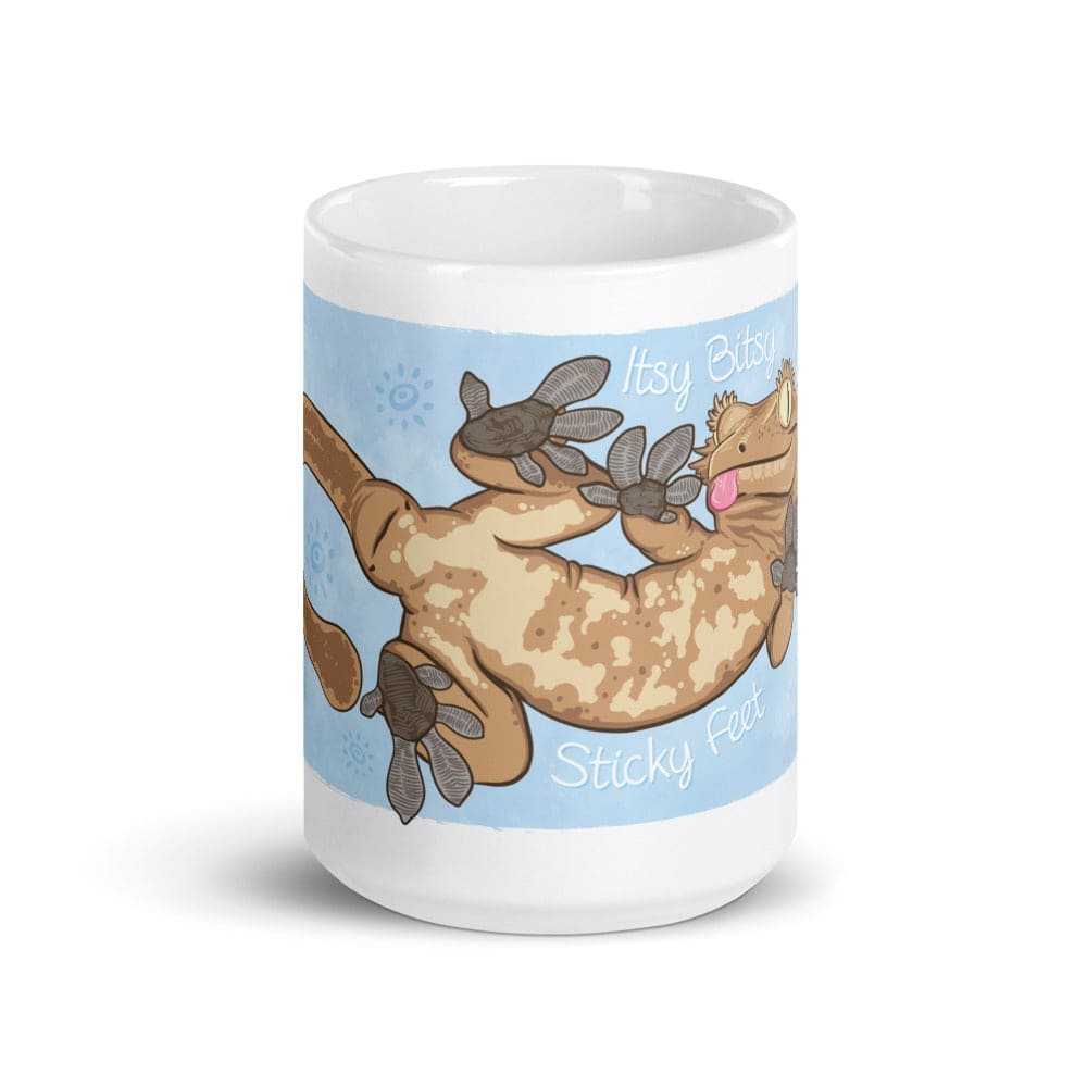 15oz mug with the front side showing the graphic for a cartoon crested gecko with Itsy Bitsy Sticky Feet on it.