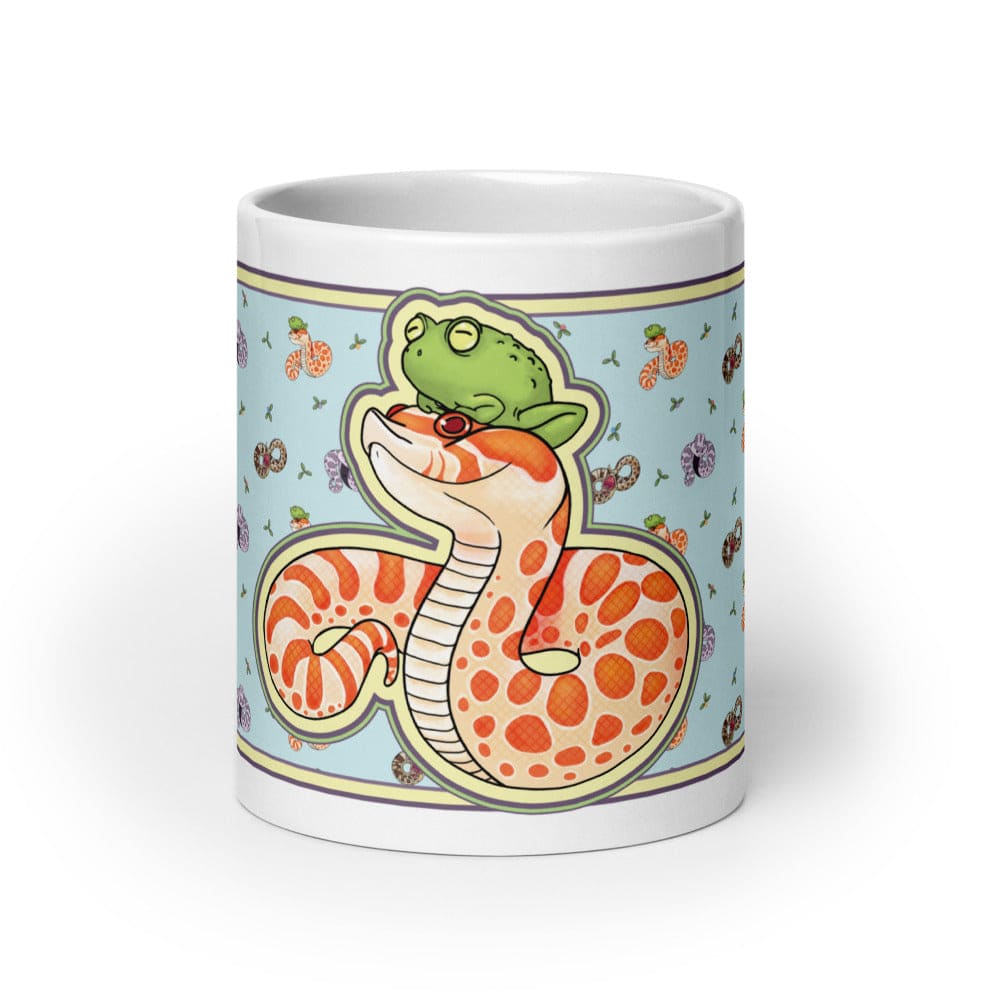 Image of a 20oz mug with a graphic showing the left side of the hognose with frog design. The background color is blue with lots of other hognose snakes and flowers surrounding it.