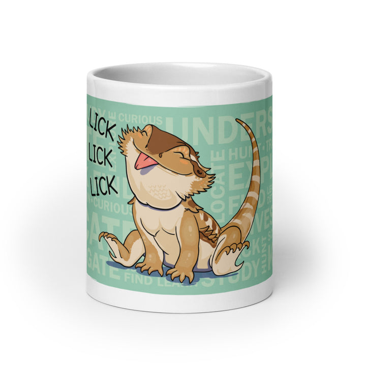 A 20oz white ceramic mug featuring a cartoon illustration of a curious bearded dragon sticking out it&