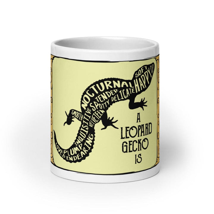 A white 20oz ceramic mug featuring a central pale yellow rectangular panel with a black silhouette of a leopard gecko. The gecko&