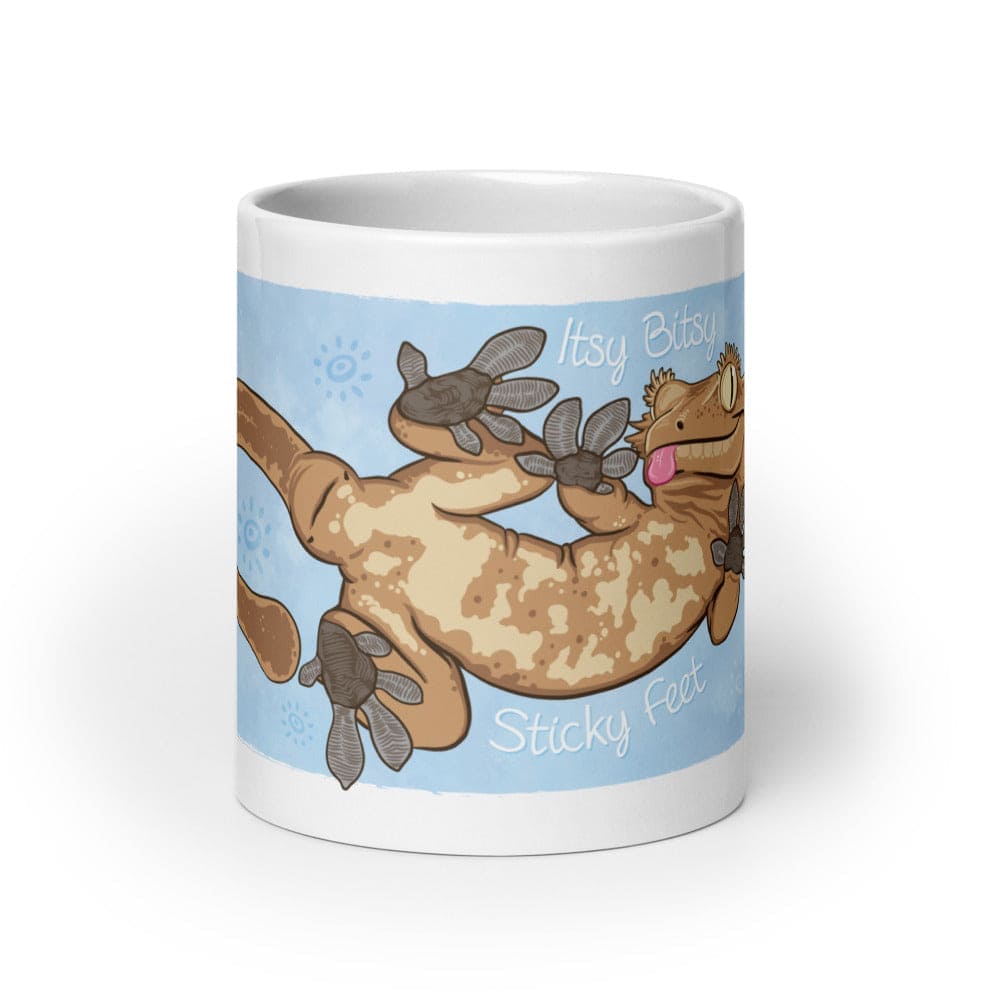 20oz mug with the front side showing the graphic for a cartoon crested gecko with Itsy Bitsy Sticky Feet on it.