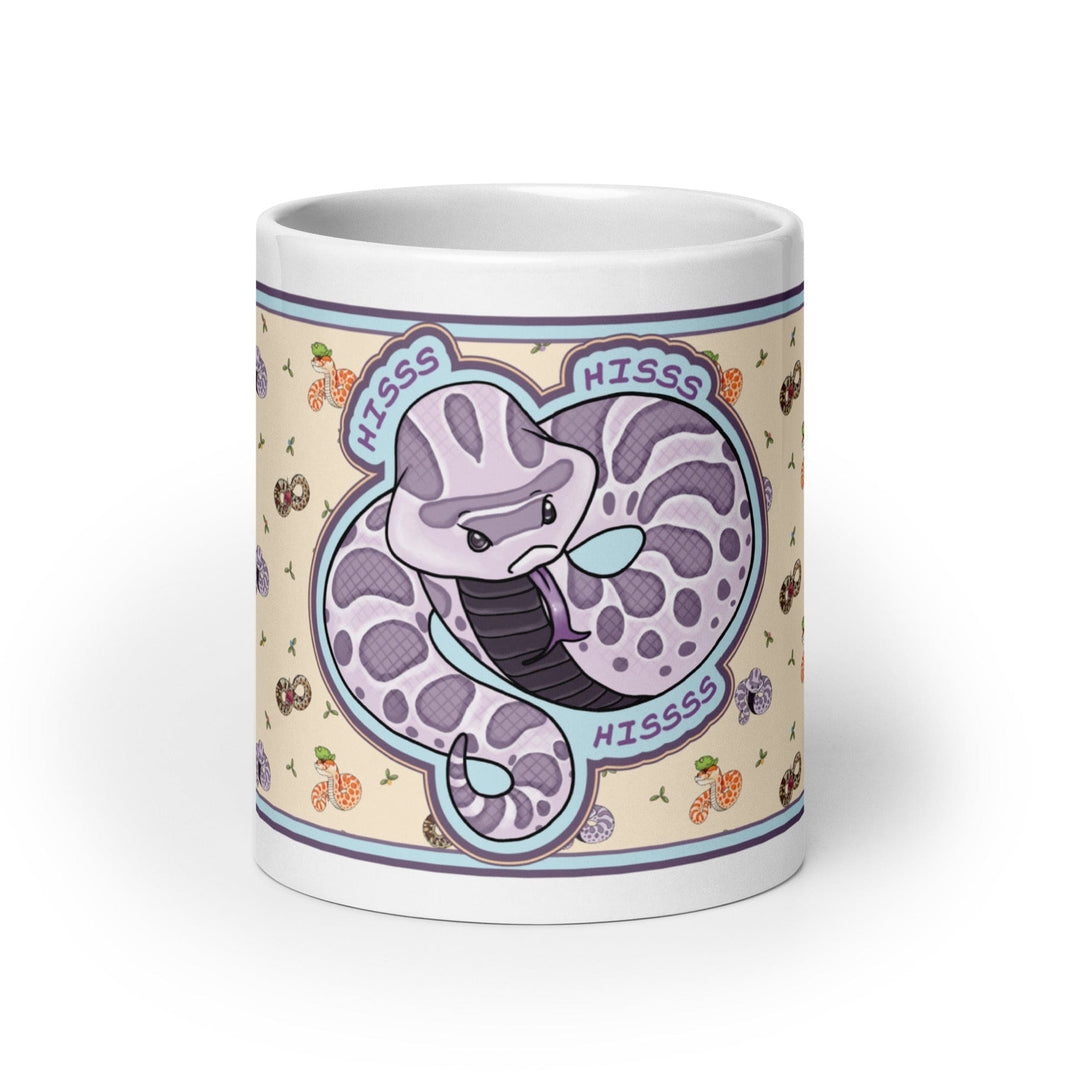 Front side of the 20oz Hognose Hiss Hiss Hiss mug. The mug has a full color wrap with some white ceramic on the handle and top and bottom. The design is cute, cartoony, with a lavender angry hoggie hissing dramatically against a pale yellow background with tiny hognoses and flowers.