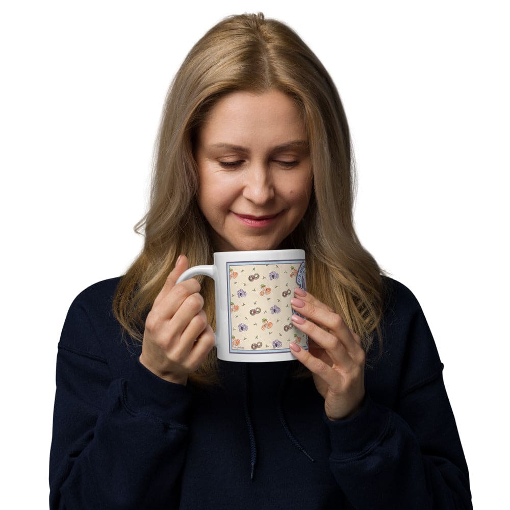 Woman holding a mug with a floral pattern and hissing hognose snake against a white background.