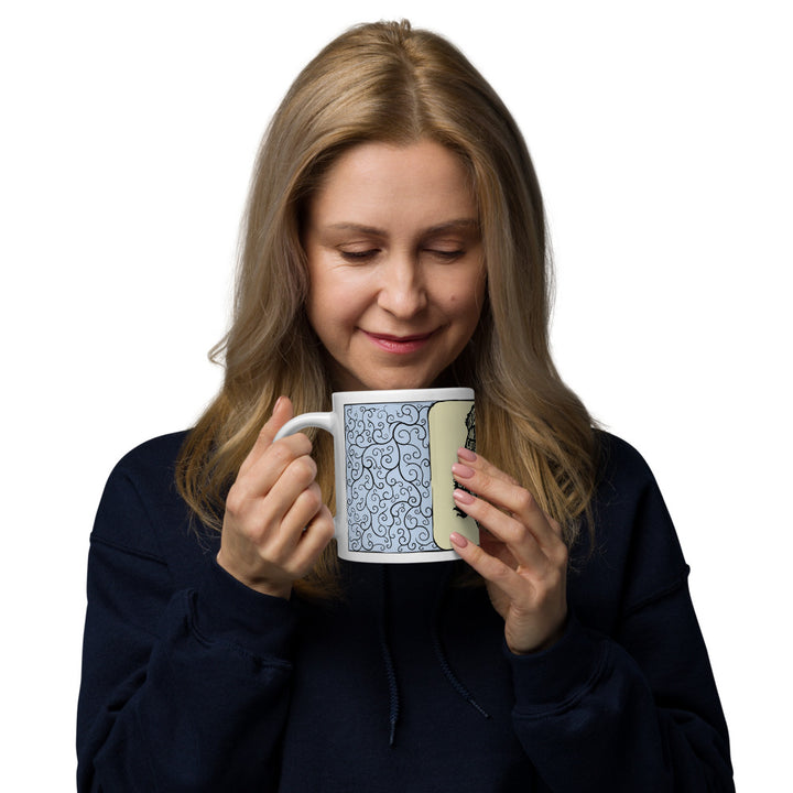 A woman holding A Beardie is mug to show scale.